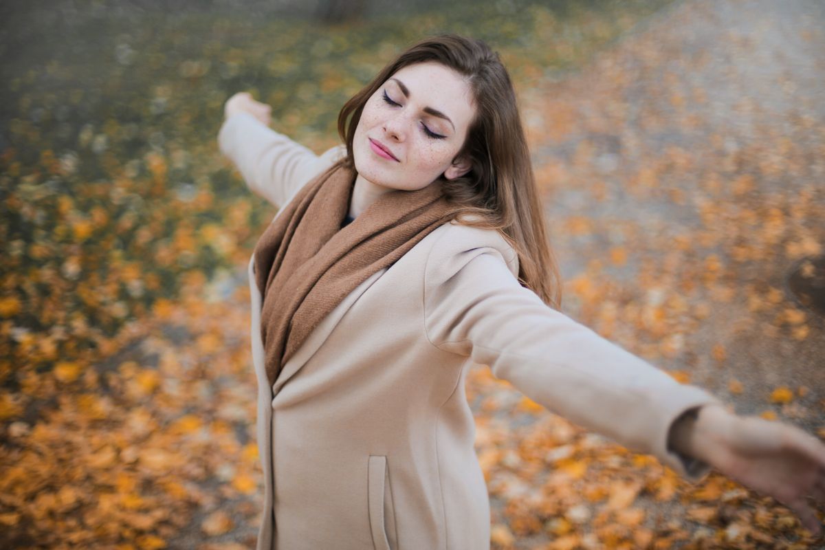 Woman relaxing peacefully with a warm drink